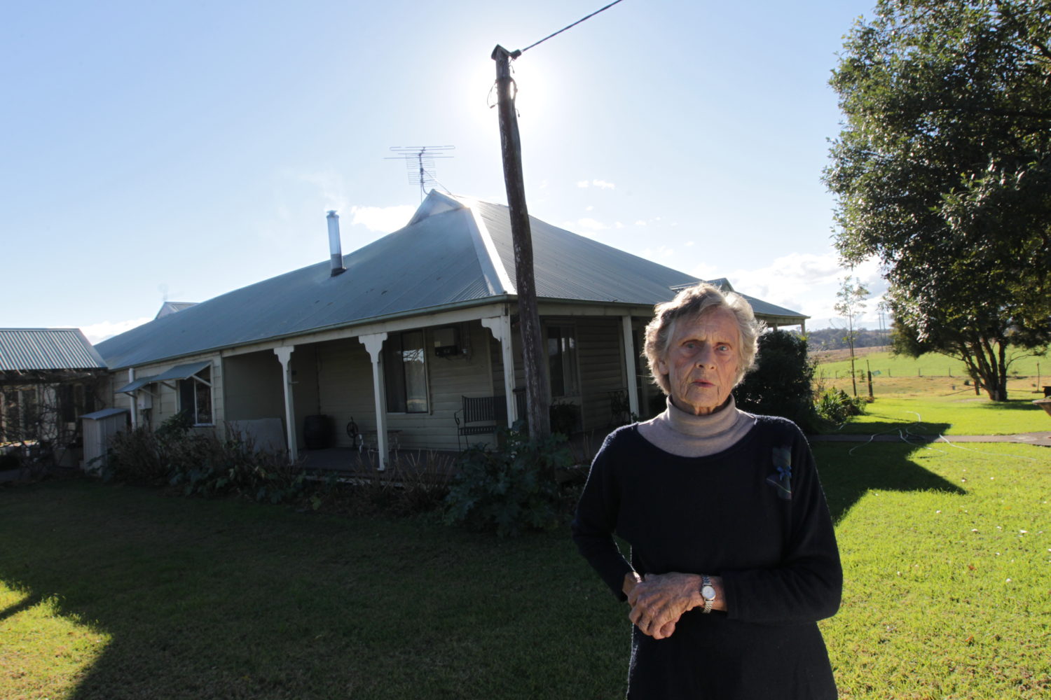 Wendy Bowman stands in front of her property.
