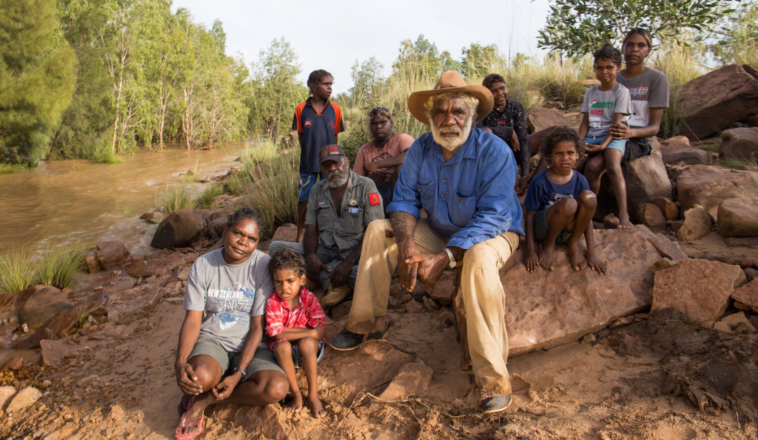 Jack and Josie Green with family on the banks of MacArthur River. Photo: Rebecca Parker